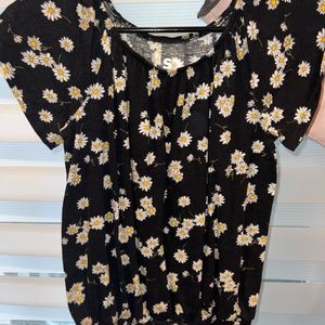 Girls black blouse with white daisies.